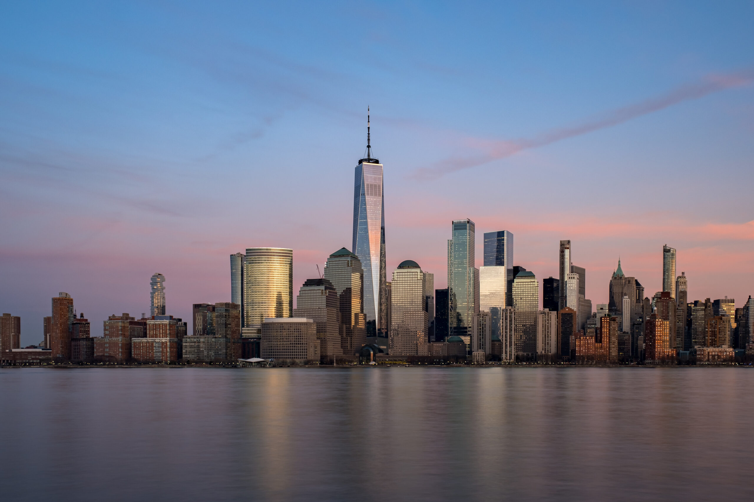 Sunset view of Clouds Moving Over Buildings in Lower Manhattan Financial District Hudson River